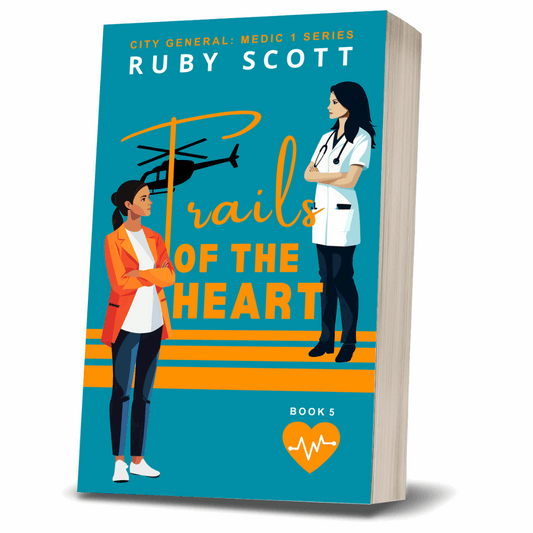 Paperback cover of 'Trails of the Heart' by lesbian romance fiction author Ruby Scott. Features two professional women facing each other with a helicopter in the background. A heartfelt lesbian romance book and compelling lesbian love story within the City General: Medic 1 Series.