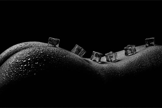 lesbian BDSM fiction image showing a naked womans back covered in ice cubes, 