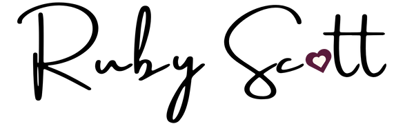 Heart icon with a white center on a black background by Ruby Scott logo