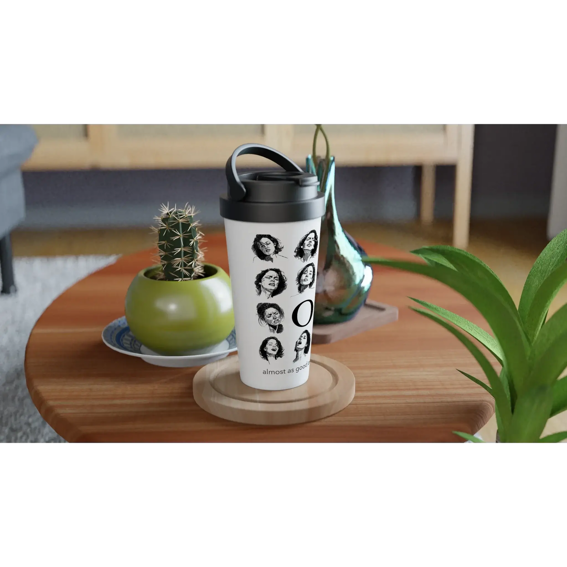 O travel mug on a table, Ruby Scott merchandise