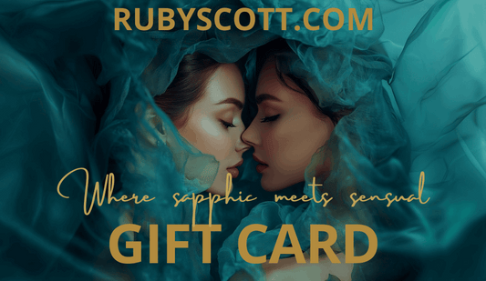 RubyScott.com gift card image featuring two women about to kiss, surrounded by teal chiffon fabric. The sensual and romantic atmosphere reflects the tagline "Where sapphic meets sensual," promoting lesbian romance book gifts, lesbian love story vouchers, and sapphic fiction reads from lesbian romance fiction author Ruby Scott