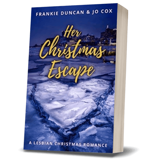 sapphic christmas romance book cover image featuring the paperback edition of Her Christmas Escape by Ruby Scott, representing a lesbian romance book, lesbian love story, and lesbian fiction by lesbian romance author Ruby Scott and lesbian romance fiction author Ruby Scott.