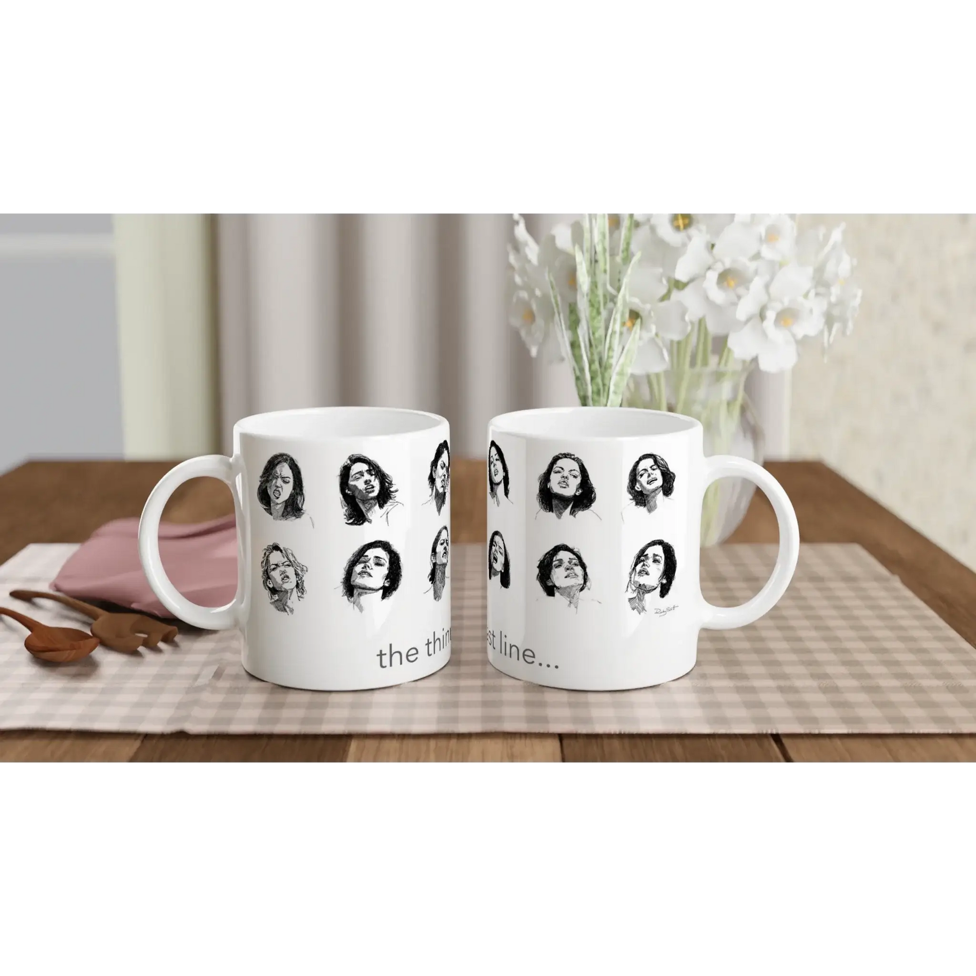 Smut reader mug featuring black and white illustrated faces with the phrase “the thinnest line…”, shown in a front-facing studio mock-up.